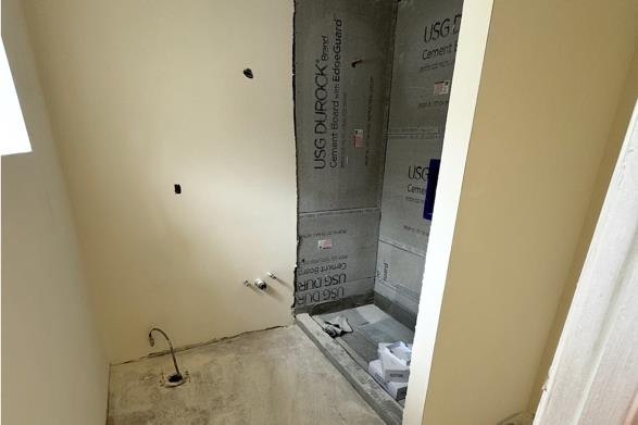 Gutted unit bathroom before renovation